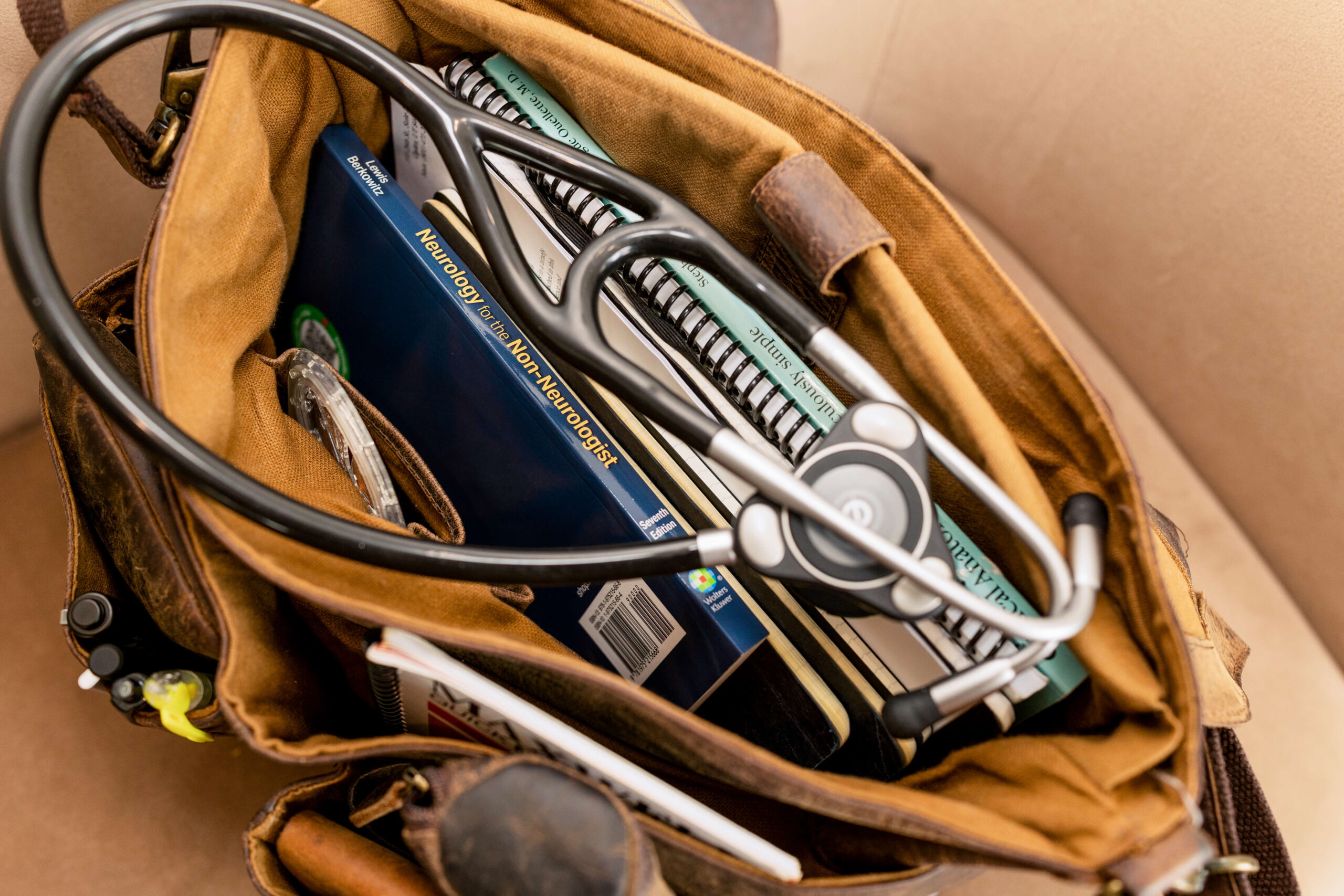 Dr. Sokol's leather doctor's bag with a stethoscope and supplies for concierge house calls