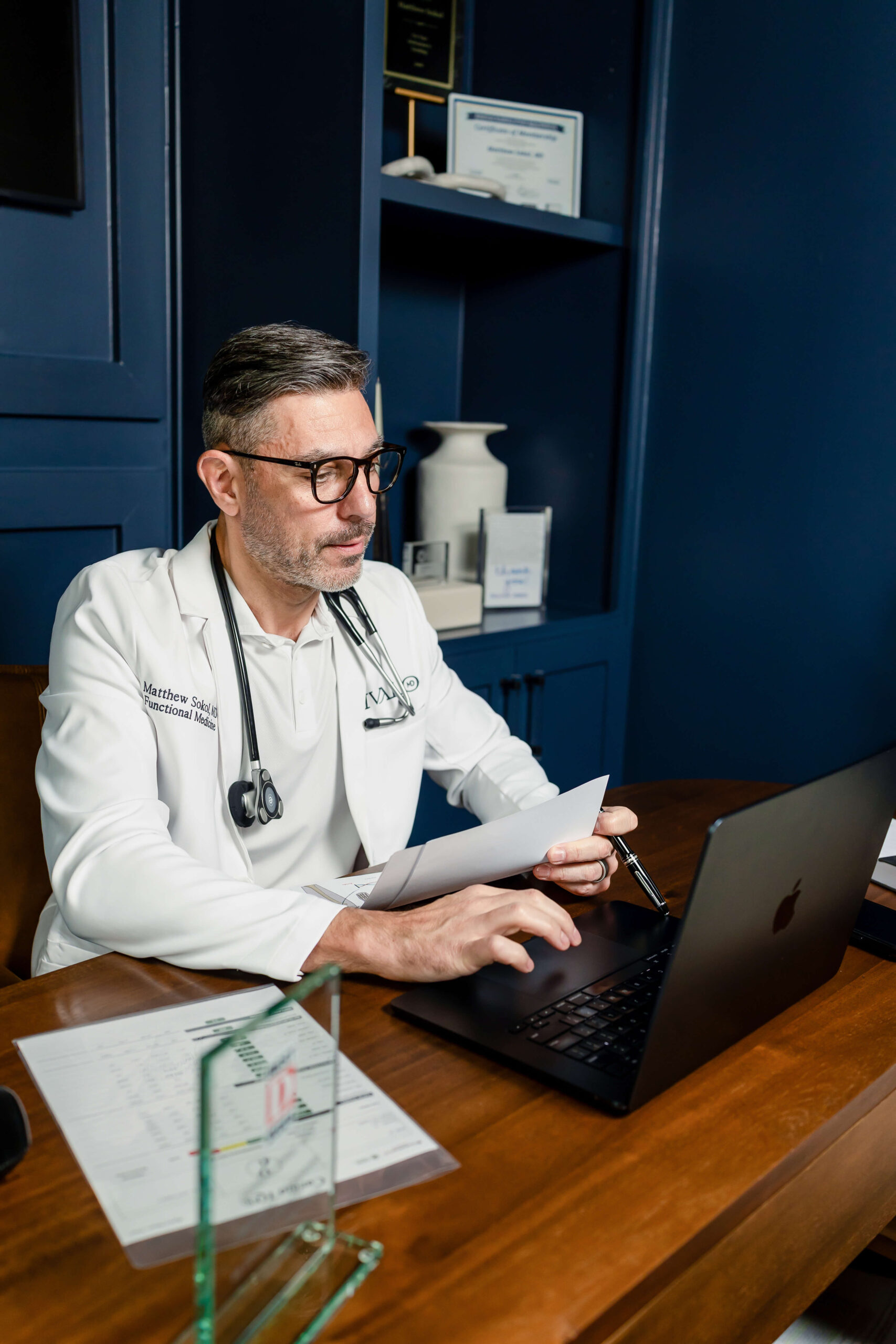 Ivalo MD branded patient materials and a health monitoring device on a table